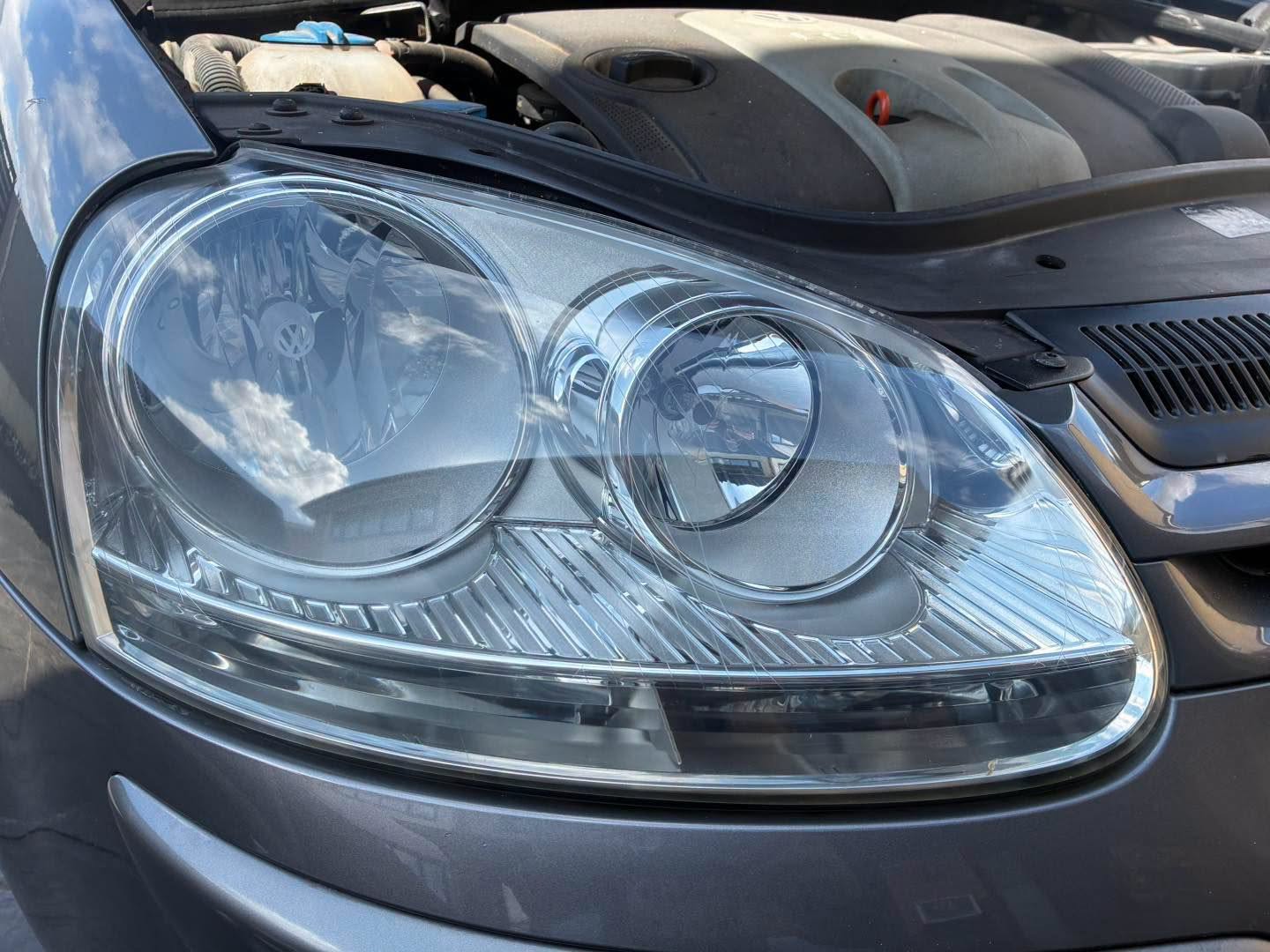 After Fresh Clean restoration: the same Volkswagen headlight with a clear lens